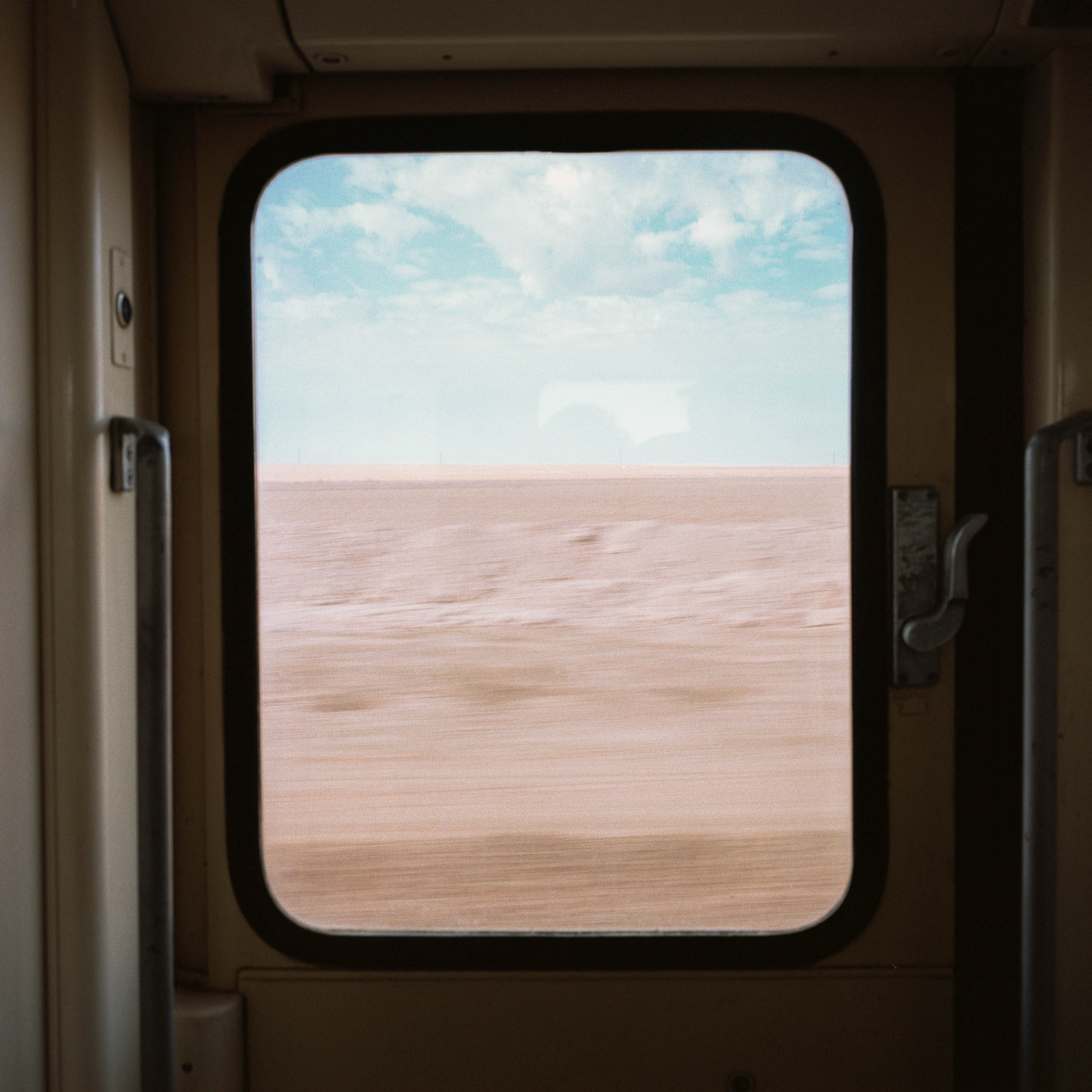 Photo of a desert landscape out of a window